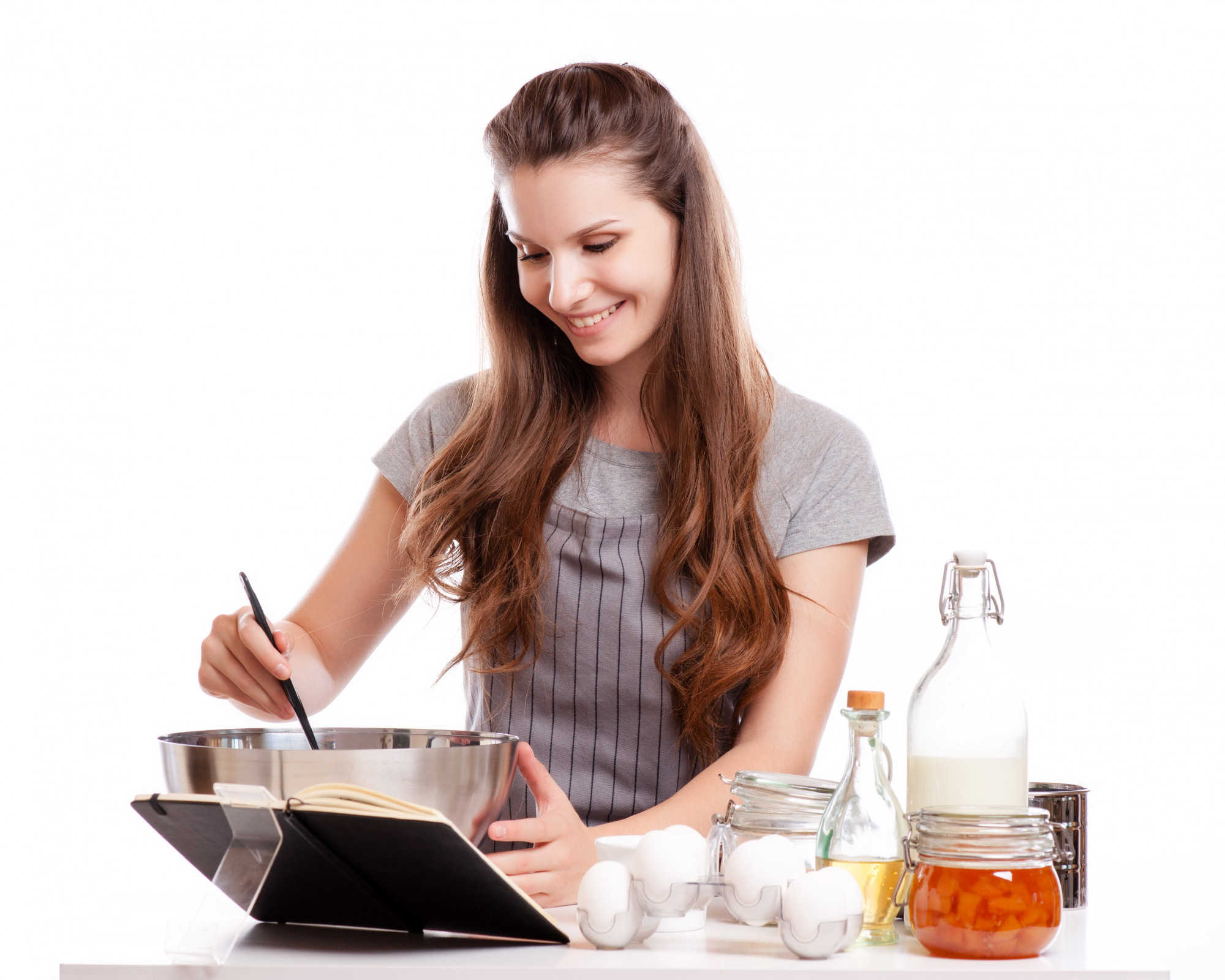 Mentor guiding student in kitchen